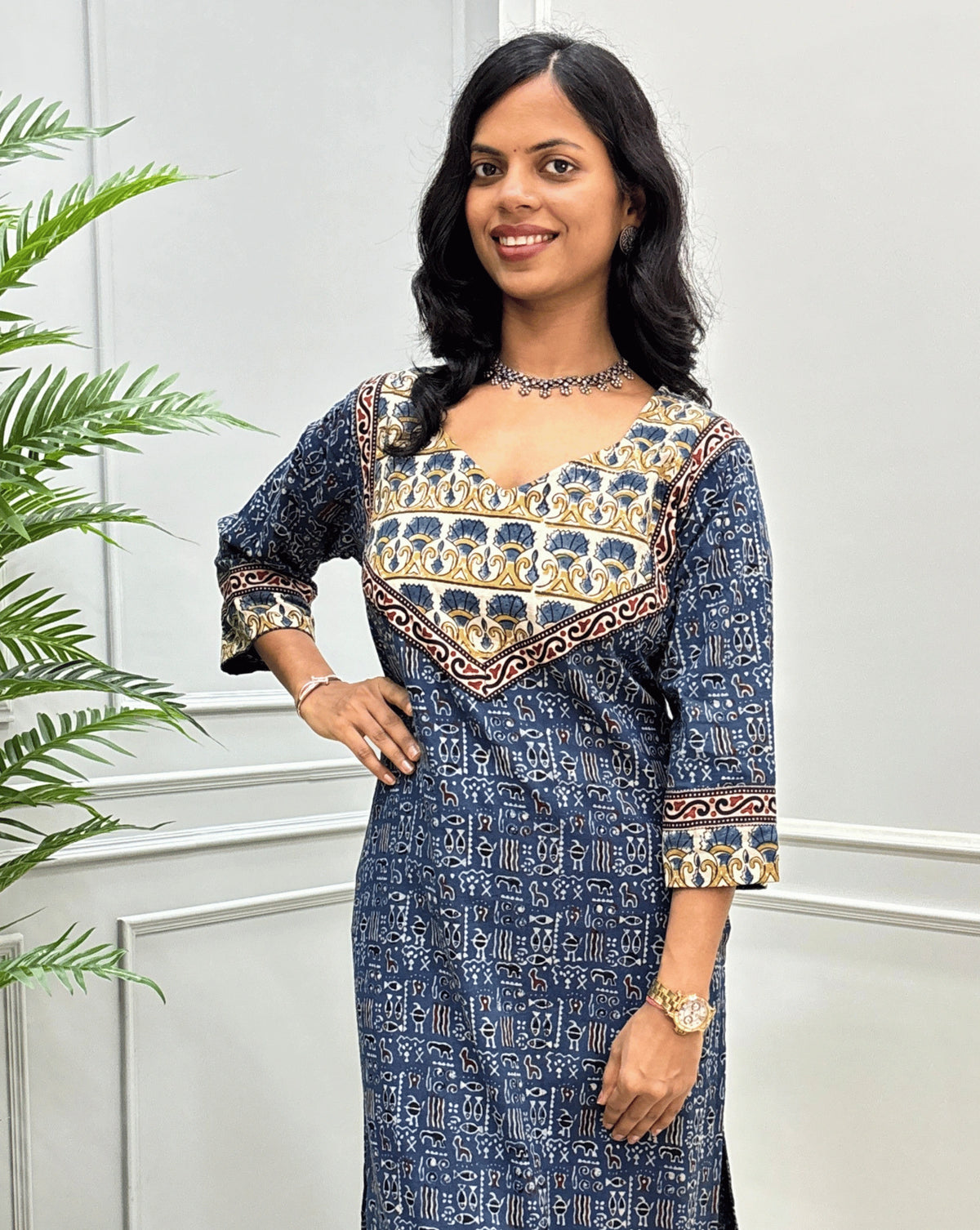 Close-up of Blue handcrafted Ajrakh long-kurti featuring with curved neck, ajrakh geometric print on front & sleeves. 