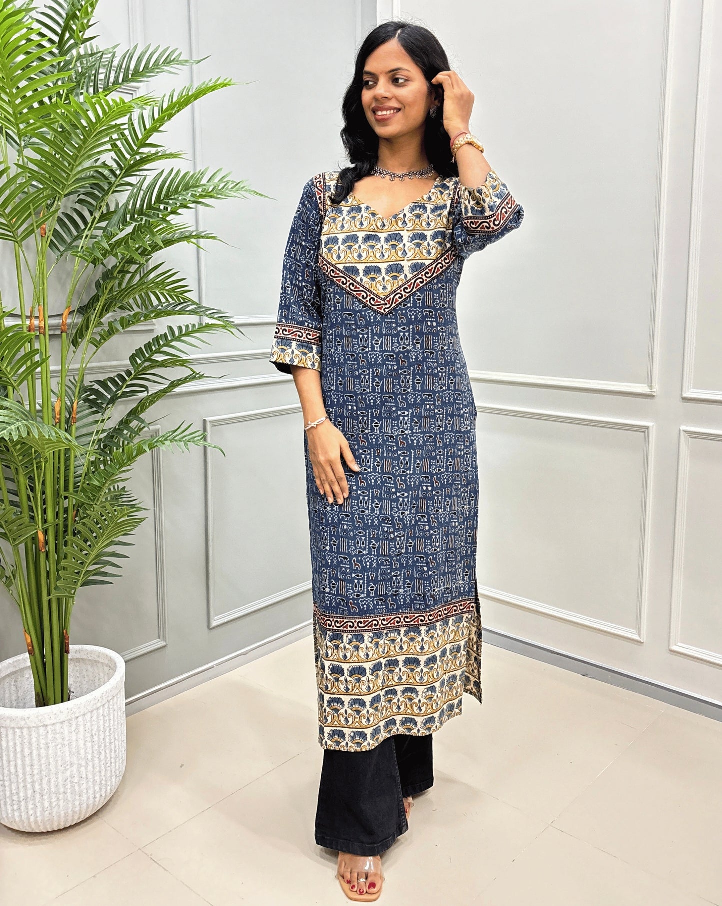Blue women's Ajrakh hand-block pure cotton long-kurti  featuring with blue & yellow Ajrakh print on white base, beige & black border on front & Sleeves. 