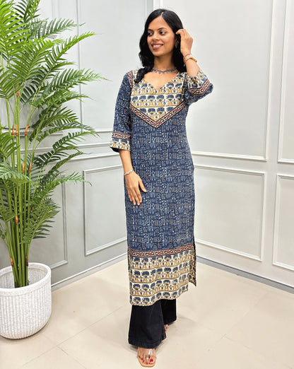 Blue women's Ajrakh hand-block pure cotton long-kurti  featuring with blue & yellow Ajrakh print on white base, beige & black border on front & Sleeves. 