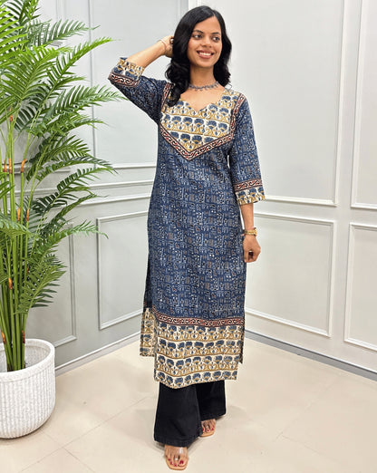 Front view of Blue & Beige Ajrakh Handcrafted Cotton Long-kurti with curved-V neck. ajrakh border-line on front and sleeves. paired with black flared jeans. 
