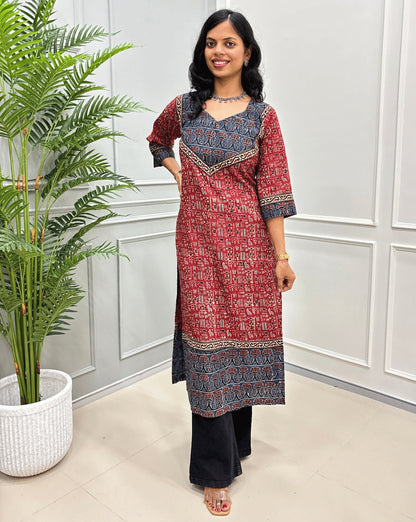 Front View of Red Hand-block cotton kurti with black - beige border &  Ajrakh print on front and sleeves, paired with black flared jeans 