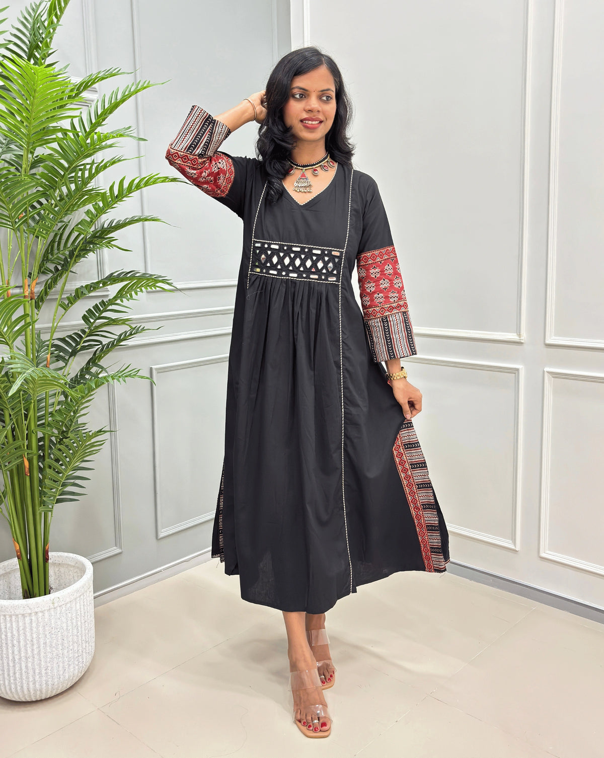 Black women's hand-block cotton long kurti with Ajrakh printed sleeves & bottom , mirror work on waist. 