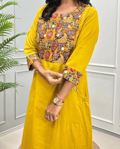 Women's Mustard yellow One-peice with a heavily Mirror embroidered multicolor yoke and matching embroidered cuffs, along with pockets