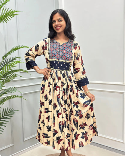 Front view of Beige women's Ajrakh plant based Cotton Long Kurti featured with Geometric print on Blue base on Curved V-neck, Hand-mirror wok on front & Sleeves cuffs. leaf print with abstract green & Red .