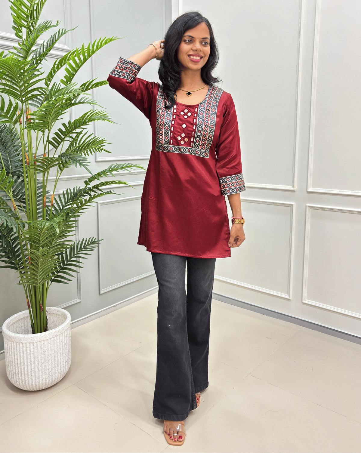 Red Women's Mashru Silk Short kurti with multi-color yoke and mirror work on front-side.