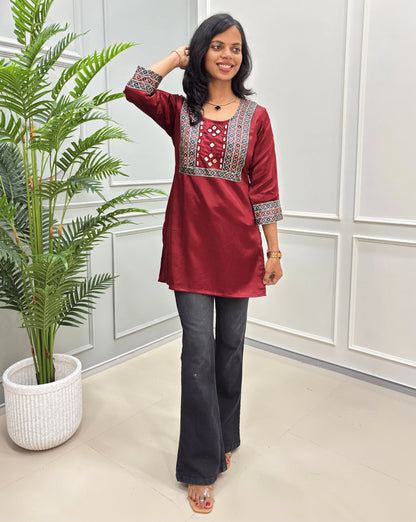 Red Women's Mashru Silk Short kurti with multi-color yoke and mirror work on front-side.