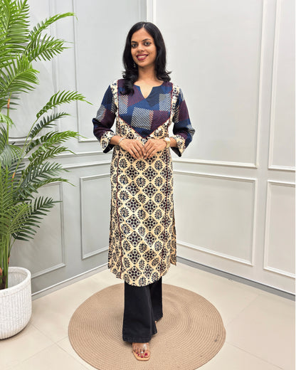 Beige Women's Vegetable dyed plant based cotton Straight Long-kurti featured strip print on blue base on front and half sleeves with peacock print from top-bottom on sleeves, standing in front of white wall and a potted plant .