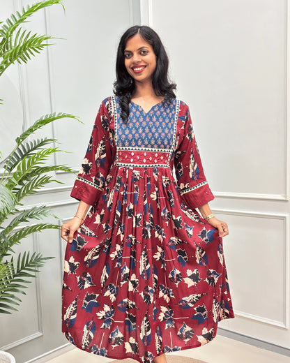 Front view of Red women's Ajrakh plant based Cotton Long Kurti featured with Floral print on Blue base on Curved V-neck, Hand-mirror wok on front & Sleeves cuffs. leaf print with abstract green & Red .