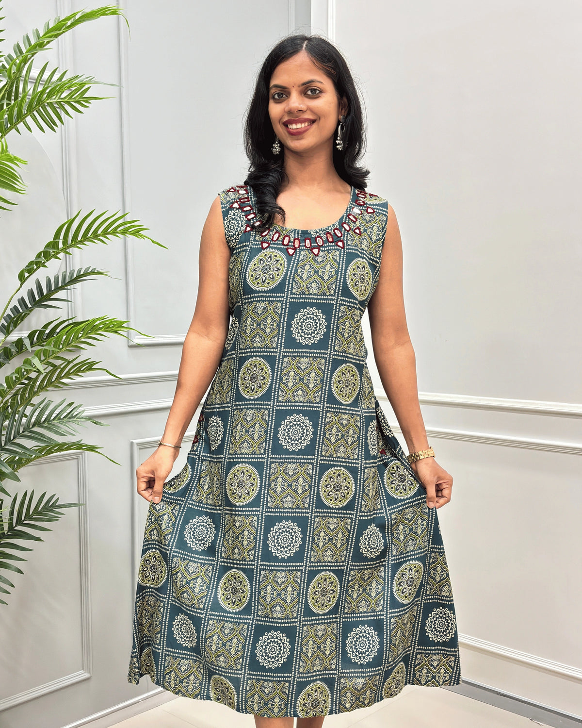 Front-view of Green women's cotton long-kurti with Round-neck & Sleevless, 3/4th length of kurti 
