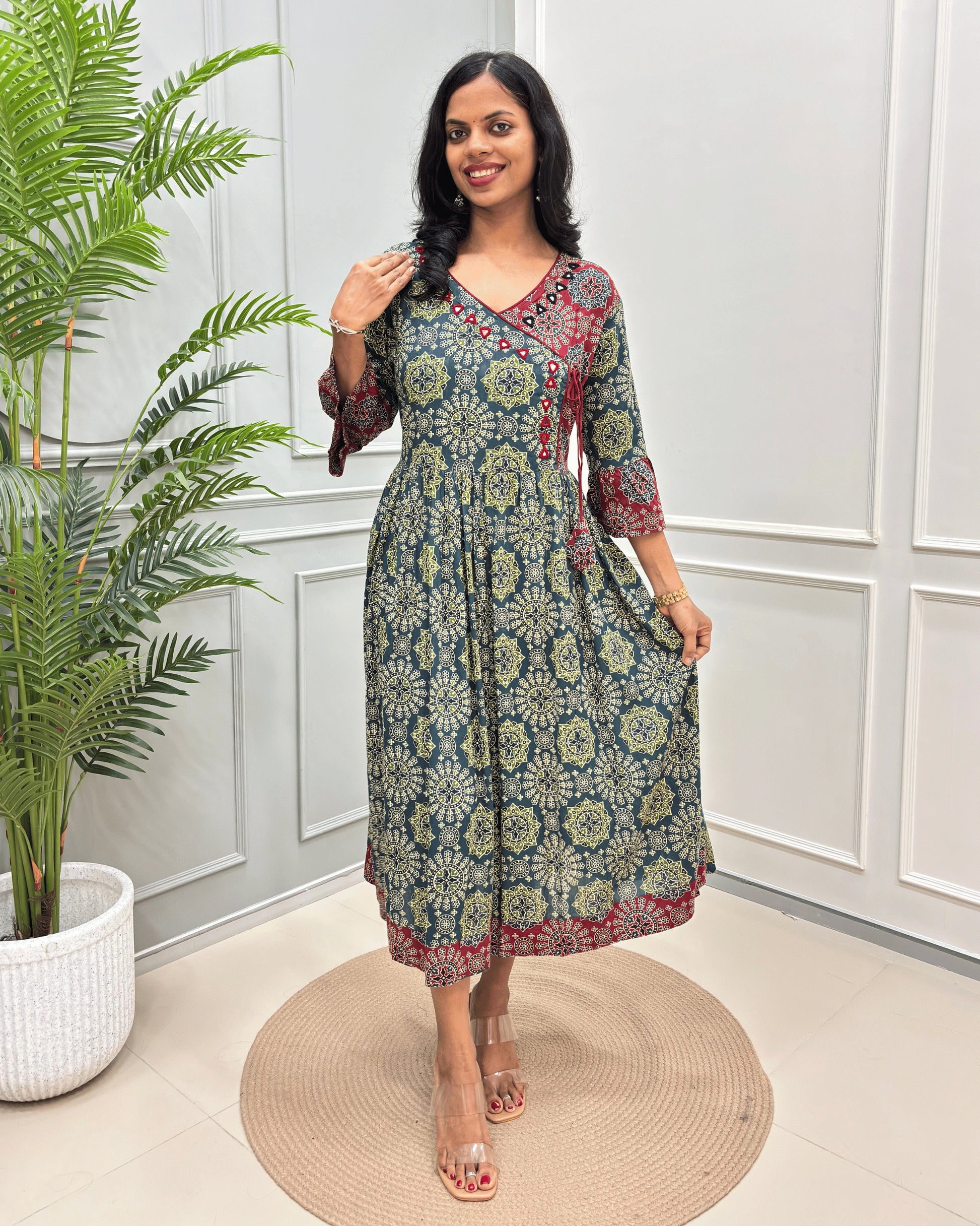 Green-Red women's vegetable dyed plant based Rayon fabric , standing on front of white wall